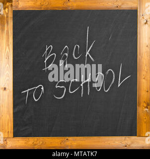Back to school handwritten with white chalk on a blackboard Stock Photo