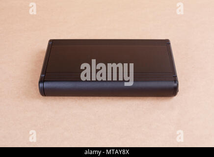 Top view of external computer hard disk drive on beige background Stock Photo