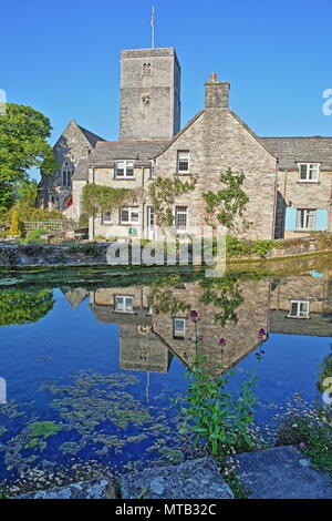 Reflections of Mill Pond cottages and St Mary's Church in Church Hill, Swanage, Isle of Purbeck, Dorset, UK Stock Photo