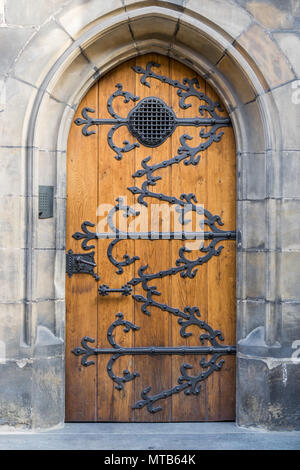 Old wooden doors with metal ornaments on the Vitus cathedral in Prague Stock Photo