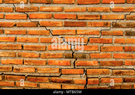 The crack wall from brick and brick background, red crack brick and pattern of crack brick wall background, old brick wall and crack texture and vinta Stock Photo
