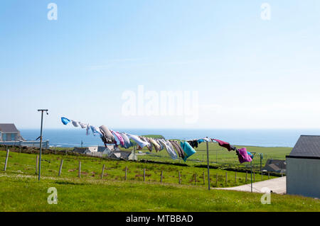 Malin Beg, a small Gaeltacht village, washing blowing dry, County Donegal, Ireland. Stock Photo