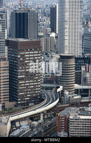 Tower Gate building in Osaka, Japan, a highway offramp at Umeda Exit passing right through the building. Stock Photo
