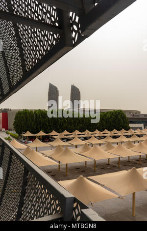 Al Bahr towers in a distance, also know as twin towers of Abu Dhabi Stock Photo
