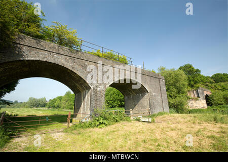 The remains of a derelict railway bridge that was part of the Somerset and Dorset Railway that once spanned the Dorset Stour River upstream from Sturm Stock Photo