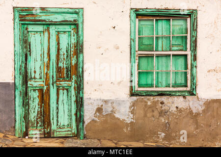 Abstract details of old wooden doors and windows, neglected with peeling paintwork and broken glass, Vilaflor, Canary Islands, Spain, Stock Photo