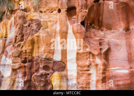Colorful, red sandstone formation texture. Abstract geological pattern. Petra, Jordan Stock Photo