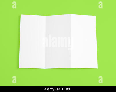Blank folding page booklet on green background Stock Photo