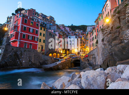 View of Riomaggiore after the sunset. Cinque Terre, Liguria, Italy. Stock Photo