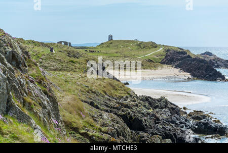 UK, Anglesey, Newborough. 19th May 2018. Llanddwyn Island view with the church ruins and Twr Mawr Lighthouse. Stock Photo