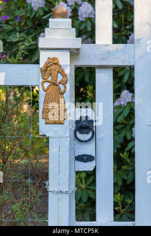 Ornate gilded gold and white wood fence gate door Stock Photo