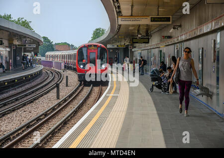 A train arrives into Wood Land London Underground Station. Stock Photo