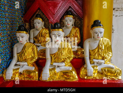 Buddha statues at Main Hall of Shwedagon Pagoda in Yangon, Myanmar. Stock Photo