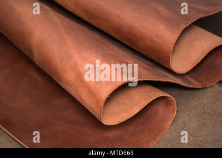 A piece of brown leather. Texture of natural material. Stock Photo