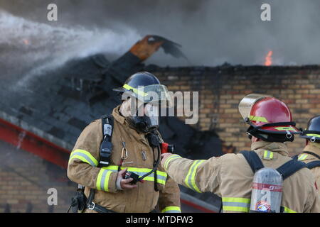 London Ontario, Canada. May 29th 2018, London, Ontario Canada, Fire broke out at the old Hooks restaurant around 5:15pm today at the corner of Southdale and Wharncliffe in London Ontario,  Fire crews were battling the flames for hours and had the blaze tame round 8 pm.  Even though the restaurant has not been open years, Londoners still have great memories and are sad to let this building go. Luke Durda/alamy Live news. Stock Photo