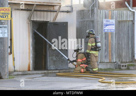 London Ontario, Canada. May 29th 2018, London, Ontario Canada, Fire broke out at the old Hooks restaurant around 5:15pm today at the corner of Southdale and Wharncliffe in London Ontario,  Fire crews were battling the flames for hours and had the blaze tame round 8 pm.  Even though the restaurant has not been open years, Londoners still have great memories and are sad to let this building go. Luke Durda/alamy Live news. Stock Photo