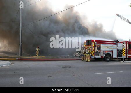 London Ontario, Canada. May 29th 2018, London, Ontario Canada, Fire broke out at the old Hooks restaurant around 5:15pm today at the corner of Southdale and Wharncliffe in London Ontario,  Fire crews were battling the flames for hours and had the blaze tame round 8 pm.  Even though the restaurant has not been open years, Londoners still have great memories and are sad to let this building go. Luke Durda/alamy Live news. Stock Photo