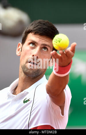 Paris. 30th May, 2018. Novak Djokovic of Serbia serves during the men's singles second round match against Jaume Munar of Spain at the French Open Tennis Tournament 2018 in Paris, France on May 30, 2018. Novak Djokovic won 3-0. Credit: Chen Yichen/Xinhua/Alamy Live News Stock Photo