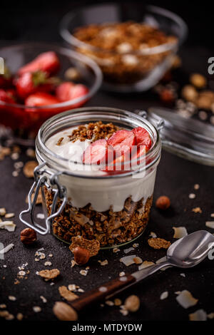 Ingredients for healthy breakfast served in glass jar Stock Photo