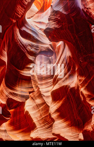 Curving walls of reflected light in lower Antelope Slot Canyon Stock Photo