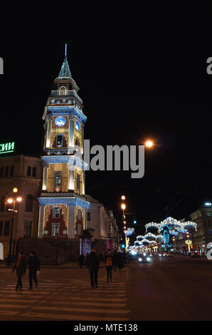 Saint-Petersburg, Russia - December 27, 2015: Nevsky Prospect at night with Christmas illumination, ordinary people walk on the street near Saint Pete Stock Photo