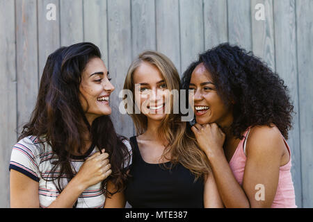 Three beautiful young women having fun outdoors Stock Photo
