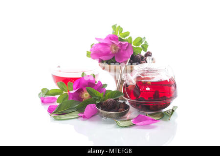 tea made from rose hips with mint on a white background with flowers Stock Photo