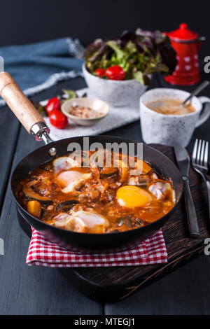 Shakshuka, Fried Eggs in Tomato Sauce for Easter Brunch. Top view. Stock Photo