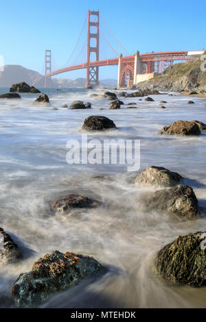 View of the Golden Gate Bridge from Rugged Marshall Beach in High Tide. Stock Photo