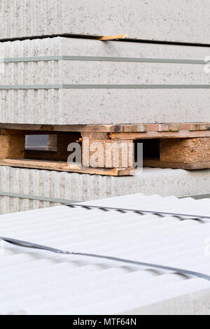 Concrete blocks building material on palette on building construction site Stock Photo