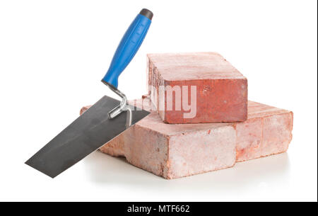 Trowel with bricks on white background - home construction or renovation concept Stock Photo