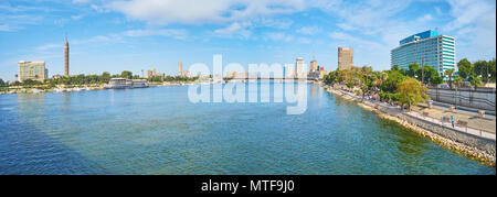 Watching wide Nile river from Qasr El Nil bridge with a view on such landmarks as Cairo Tower on Gezira Island and Downtown district, on December, Cai Stock Photo