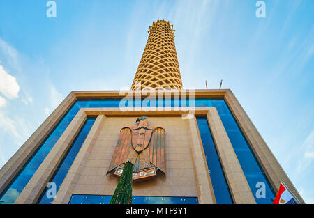 The facade wall above the entrance to Cairo Tower with sculpture of eagle - National Emblem of Egypt. Stock Photo