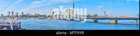 Panorama of rivrside area with a view on Qasr El Nil bridge, stretching across the Nile river to Gezira Island, Cairo, Egypt. Stock Photo