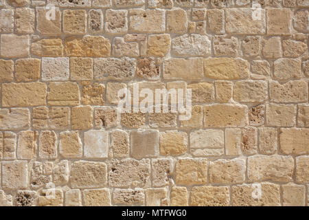 Traditional sand stone wall background in Cyprus Stock Photo