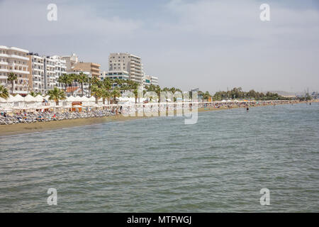 Cyprus, Larnaca at summer. Seafront multi-storey buildings, sandy beach, blue sea and sky Stock Photo