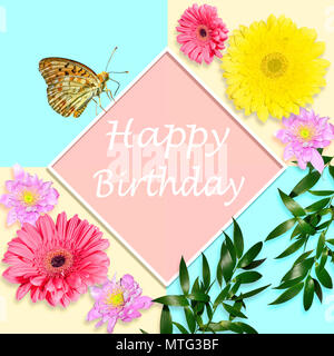 Happy birthday bright greeting card concept with gerbera flowers, chrysanthemums and butterfly sitting on diamond-shaped white frame on geometrical ba Stock Photo