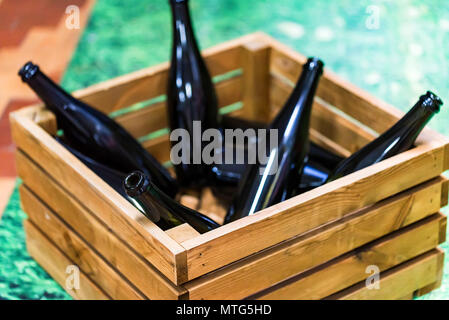 Empty wine bottles in wooden box Stock Photo