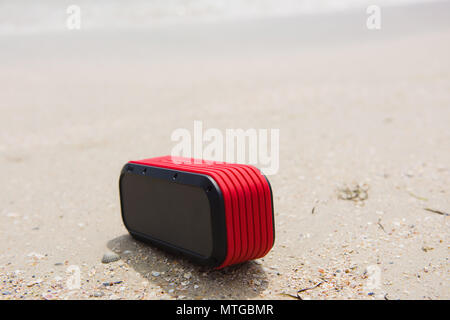 New cool bluetooth usb wireless acoustic at sand Stock Photo
