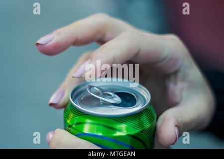 Close up of a hand opening a beverage. Stock Photo