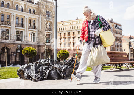 Unhappy poor man looking for food Stock Photo
