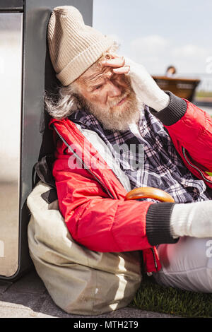Unhappy bearded man feeling depressed Stock Photo