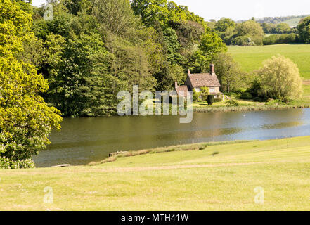 Lakeside cottage lake at Bowood House and gardens, Calne, Wiltshire, England, UK Stock Photo