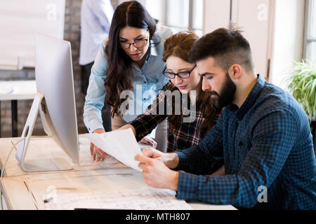 Young architects working on project in office Stock Photo