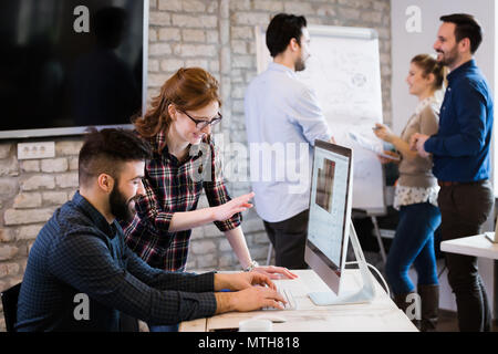 Young architects working on project in office Stock Photo