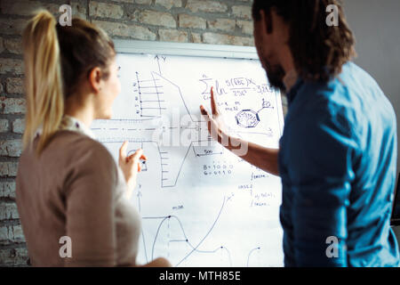 Young architects working on project in office Stock Photo
