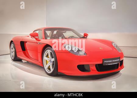 STUTTGART, GERMANY-APRIL 7, 2017: Red 2003 Porsche Carrera GT in the Porsche Museum. This car is the one of the most valuable in the world. Stock Photo