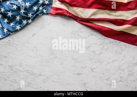Close-up american flag on white marble background. Stock Photo