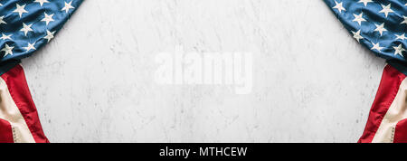 Close-up american flag on white marble background. Stock Photo
