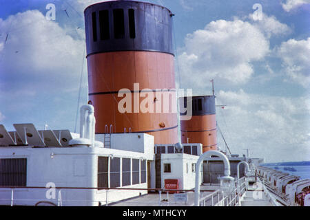 RMS Queen Elizabeth was an ocean liner operated by Cunard Line. The image shows her docking at Southampton in 1962 Stock Photo